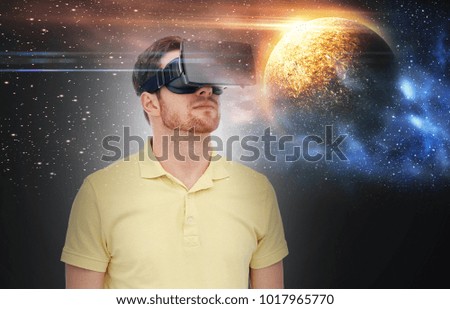 technology, augmented reality and people concept - young man with virtual headset or 3d glasses over planet and space background