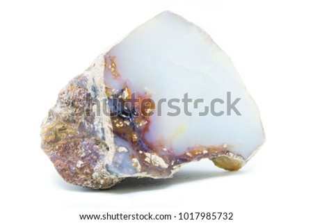 Natural opal stone polished on a white background