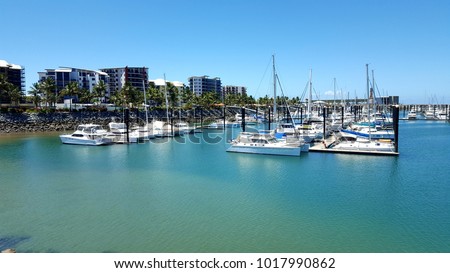 Mackay, Queensland, Australia - December 30, 2017 - Mackay Harbour with yachts and houses Royalty-Free Stock Photo #1017990862