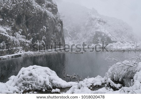 Landscape picture of Plitvice Waterfalls and National Park, Croatia in the snow