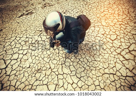 
Stock photographers are taking a cracked ground for sale as a background image.