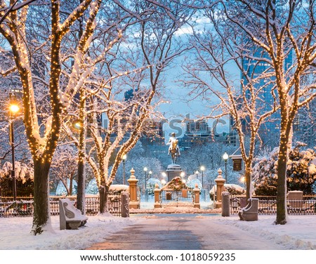 View of Boston in Massachusetts, USA in the winter season at Commonwealth Avenue with snow and Christmas lights.