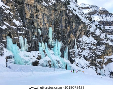 January, 2018: Alta Badia, Italy - micro freezed turquoise waterfalls in the mountains