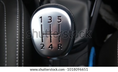manual gearbox in the car macro black Royalty-Free Stock Photo #1018096651