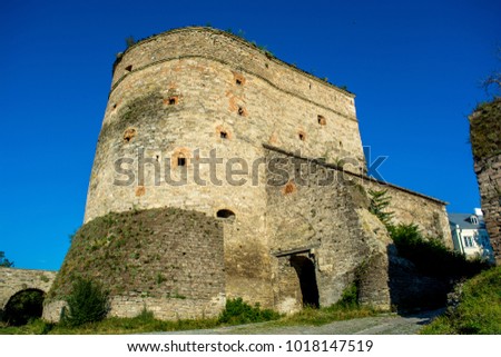 Photo of old ancient stone tower of castle in Kamyanets-Podilsky