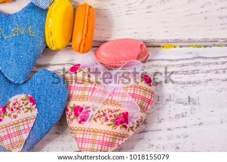 heart of fabric on a background of old white boards to the underlay on the Internet and articles on sweets, holiday concept