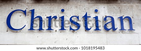 Landscape shot of a single word in blue letters reading "Christian"