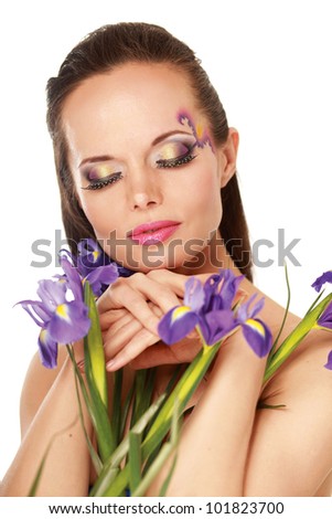 Beautiful young woman with blue flowers