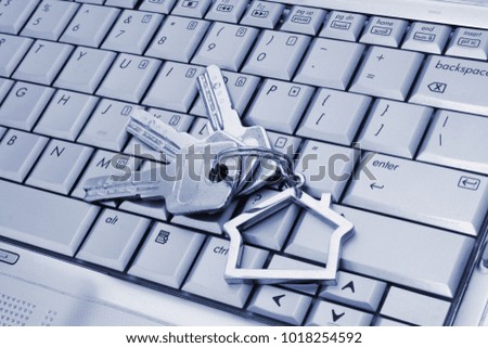 Laptop keyboard with keys, find real estate online theme