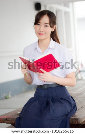 asia thai high school student uniform beautiful girl read a book