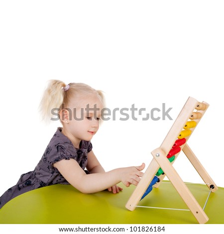 pretty little child playing with the abacus