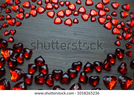 Valentine day background with red hearts. Beautiful romantic composition. Wooden background with hearts. The new concept of Valentine Day. Popular design of Valentine Day. Bokeh background.