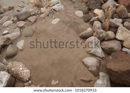 rock beach with black sand