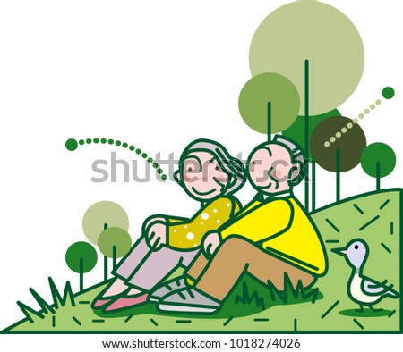 Old couple sitting on grass