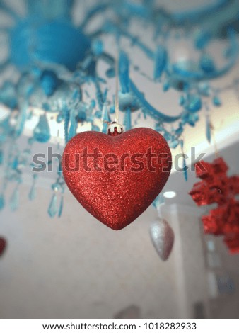 Red heart on chandelier