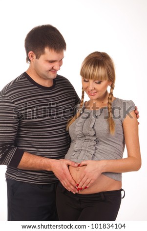 Young pregnant couple. Isolated on white background.