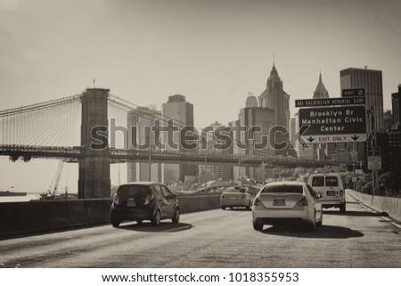 NEW YORK CITY - OCTOBER 20, 2015: Cars speed up on FDR Drive. Traffic is very high on this road.