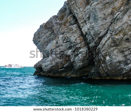 The cliff on the sea and
floating boat
