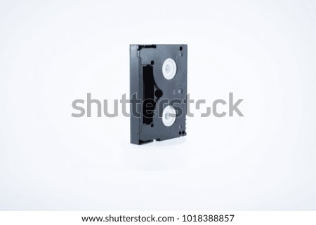 Old video cassette tape on white background.