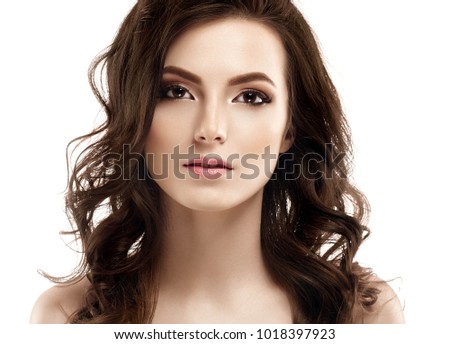 Young beautiful woman face portrait with healthy skin. Studio shot.