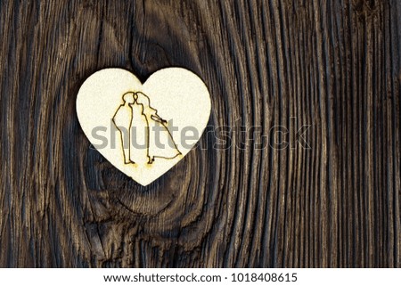 small heart on a wooden background