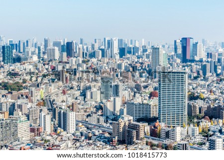 Asia Business concept for real estate and corporate construction - panoramic modern city skyline aerial view of Odaiba area and Tokyo Metropolitan Expressway under blue sky in Tokyo, Japan