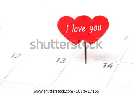 Valentines day concept. I love you word and paper red hearts pin on day 14th february at calendar