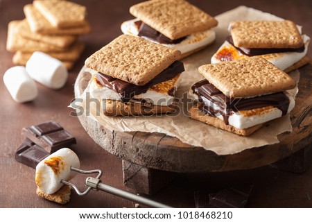 homemade marshmallow s'mores with chocolate on crackers Royalty-Free Stock Photo #1018468210