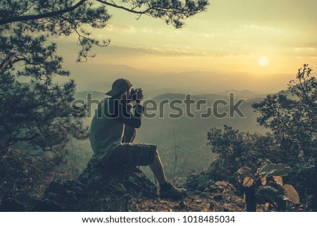 picture of a sunset from a high mountain.
