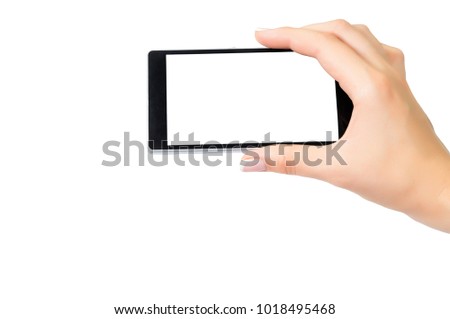 The girl uses a mobile phone in horizontal mode. Hand. Manicure.