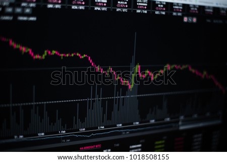 Stock graph on computer on black background.