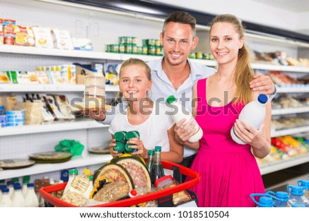 Emotional family customers choosing yogurt in shop
