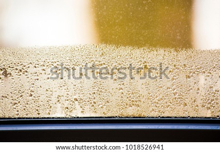  Rainy window ,drops on glass ,water ,golden ,silver ,texture ,interior ,exterior ,wet ,transparent ,close up ,macro ,small ,big ,yellow ,brown ,background ,sweat