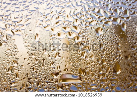 Rainy window ,drops on glass ,water ,golden ,silver ,texture ,interior ,exterior ,wet ,transparent ,close up ,macro ,small ,big ,yellow ,brown ,background ,sweat
