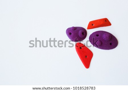Climbing holds on white background