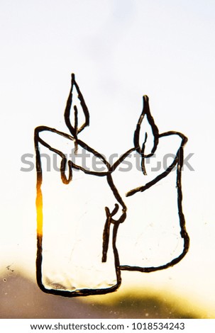  Candle light drawn on the glass ,decoration ,christmas ,interior ,window ,picture ,hand made ,holiday ,ornament ,black ,white background ,simple ,mood
