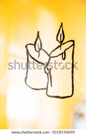 Candle light drawn on the glass ,decoration ,christmas ,interior ,window ,picture ,hand made ,holiday ,ornament ,black ,white background ,simple ,mood