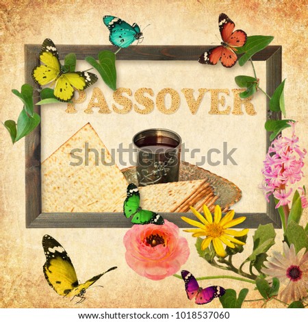 Wooden picture frame created with beautiful wild flowers and butterflies. Pesach Passover symbol of Jewish holiday. Traditional matzoh or matzo and wine in vintage silver plate and glass. Retro style
