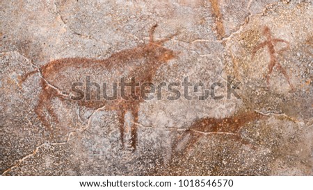 The scene of an ancient hunt on a cave wall, made with ocher. archeology. antiquity