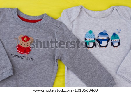 Close-up kid cotton t-shirts with images. Top close up view of cute kid t-shirts made of cotton.