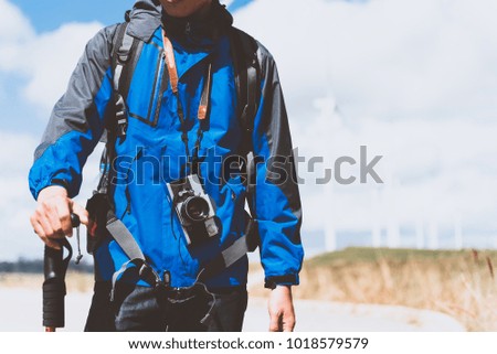 Traveler man with retro camera Fashion Travel Lifestyle outdoor
