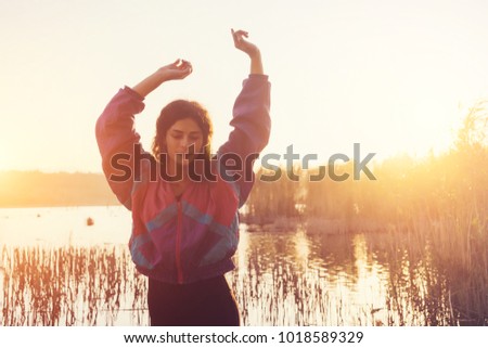 happy woman holding a tablet in hands