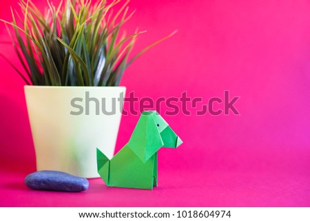 Creative lay out Chinese New Year 2018.Dog and rabbit paper origami in red background.Dog and rabbit origami with copy space.Selective Focus shot.