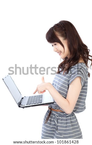Beautiful young woman using a laptop computer. Portrait of asian
