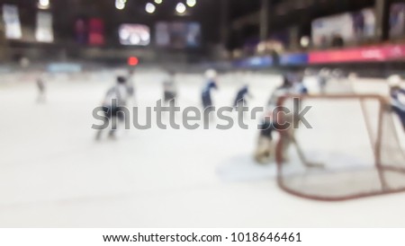 blurred ice hockey in indoor stadium
