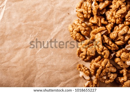 Walnut on a dark rustic wooden background.