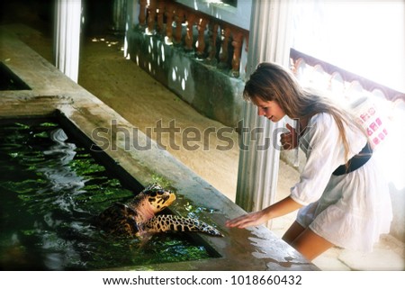 girl in a turtle farm, Bentota, Sri Lanka Royalty-Free Stock Photo #1018660432