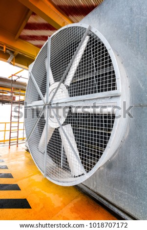 Big industrial cooler fan or cooler fan big  engine in factory for reduced heat in operation. Royalty-Free Stock Photo #1018707172