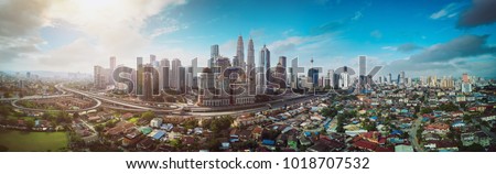 Panorama cityscape view in the middle of Kuala Lumpur city center , early morning with little mist , Malaysia . Royalty-Free Stock Photo #1018707532