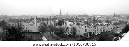 black and white panoramic view of the city of Montargis under the snow